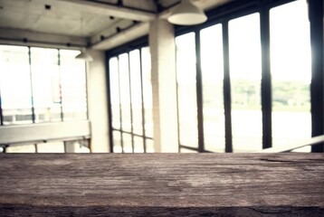 Empty wooden table in front of abstract blurred background of coffee shop . can be used for display or montage your products.Mock up for display of product