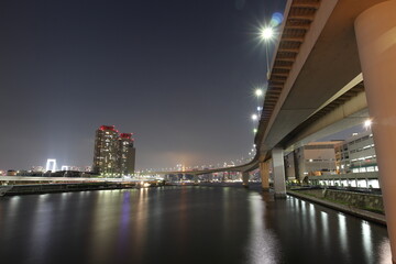 Night view of Odaiba high-rise apartments and highway in Japan