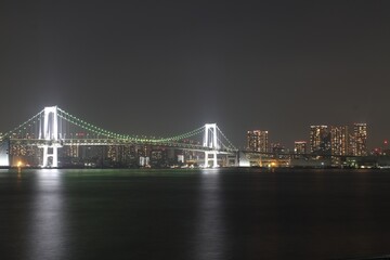 Fototapeta na wymiar Night view of Rainbow Bridge in Tokyo, Japan