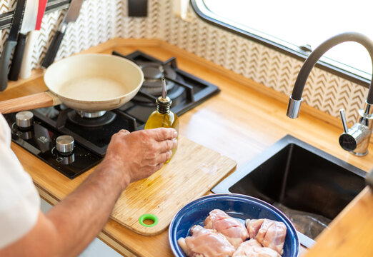 Older Man Cooking In His Motorhome,