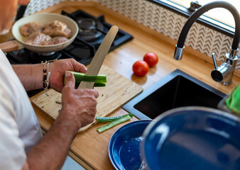 older man cooking in his motorhome,The Art of Cooking in Motion