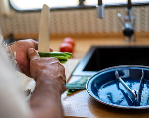 older man cooking in his motorhome,Culinary Pleasures on Wheels