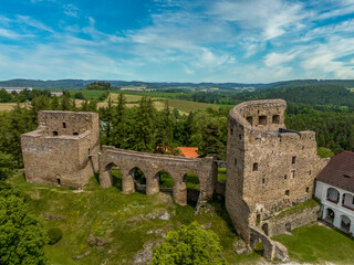 Fototapeta na wymiar Aerial view of Velhartice castle in Bohemia with two Gothic palaces connected by a unique stone bridge