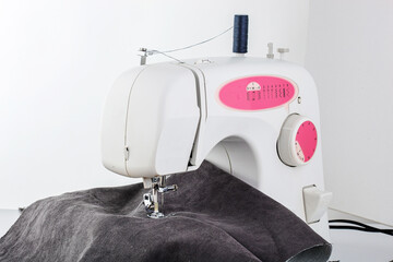 Sewing machine, stitching fabrics, needle in a round plan