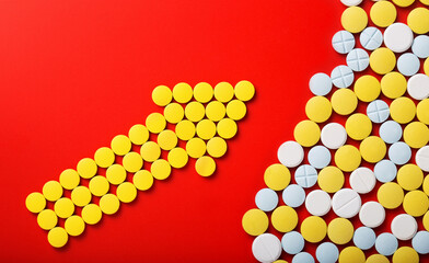 Medical pills . On red background. Top view .