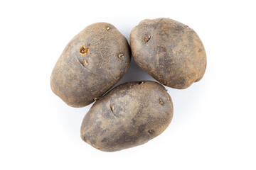 Fototapeta na wymiar Three raw potatoes, unpeeled. Isolated on a white background.