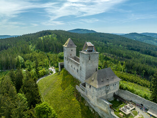 Fototapeta na wymiar Aerial view of Kasperk Hrad or Karlsberg castle in Czechia. The central part of the castle consists of two residential towers and an oblong palace which was built between them
