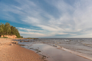 Fototapeta na wymiar Ezhurgas cliffs (latvian: Ežurgas klintis) on Baltic sea shore in Latvia on summer day