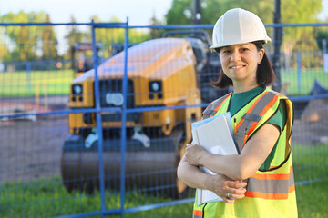 Outdoor builder woman portrait, construction worker