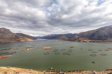Ladscape of floating islands and fish farm on Cat lake, Adiyaman, Turkey. A floating island is a...