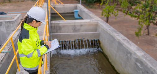 Environmental engineers work at wastewater treatment plants,Water supply engineering working at Water recycling plant for reuse,Check the amount of chlorine in the water to be within the criteria. - obrazy, fototapety, plakaty