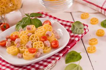 Ruote pasta with tomato and ham. - 616769080
