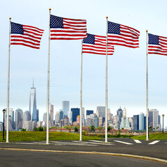 Fototapeta premium a view of Manhattan city skyline from battery park , American flags in battery park, new jersey, USA 