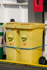 Spill kit yellow wheelie bin for health and safety of chemical, oil, diesel or petrol pollution leak