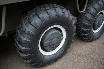 Fototapeta na wymiar Big black wheels of an all-terrain vehicle.
