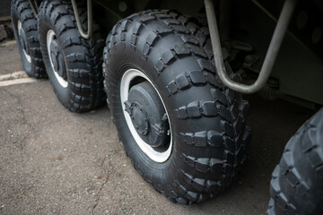 Obraz na płótnie Canvas Big black wheels of an all-terrain vehicle.