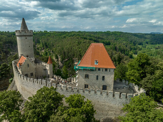 Fototapeta na wymiar Aerial view of Kokořín Kokorin Castle in Czechia Neo-gothic restauration of a hilltop ruined medieval fortress