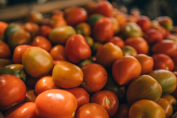 Fresh organic tomatoes for sale at an indoor market store.
