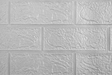 Textured tile flooring fills frame with patterned background.
