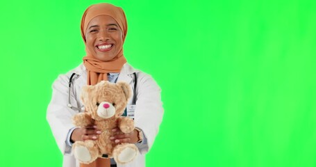 Teddy bear, face of doctor and Muslim woman on green screen in studio isolated on a background mockup. Gift, portrait and happy medical professional with charity toys, present and funny pediatrician. - Powered by Adobe