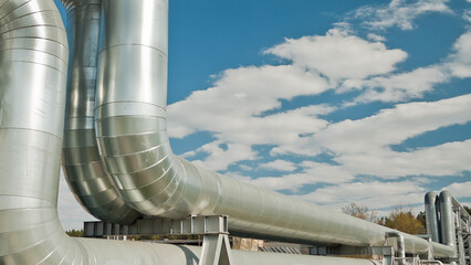 pipeline close-up in the background blue sky and clouds