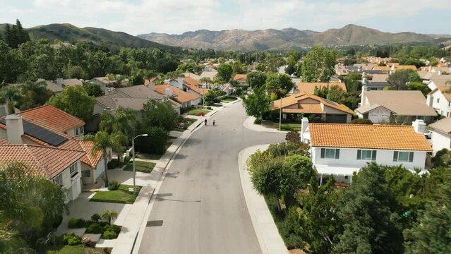 Aerial view of wealthy suburb area in Los Angeles. Typical district in Los Angeles California USA. Houses with swimming pools. Drone shot of suburban neighborhood. High quality 4k footage