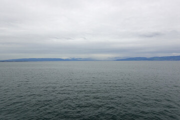 Obraz premium Panorama of Bodensee lake and a yacht, the view from Romanshorn, Switzerland