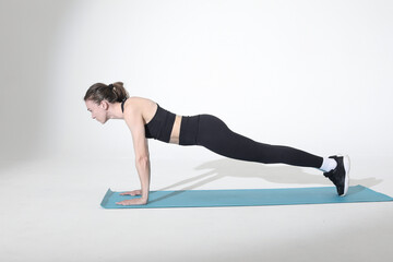woman doing static plank fitness exercise