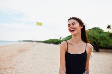 vacation woman sand young beach nature sea summer ocean smile tropical