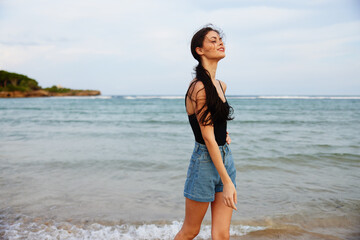 Fototapeta na wymiar vacation woman coast beach sea ocean sand sunset lifestyle summer smile