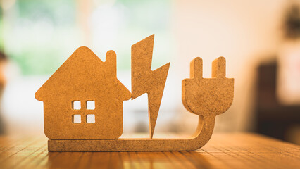 Model house and electricity and plug The concept of crazy electricity consumption and electricity...