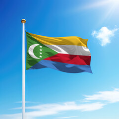 Waving flag of Comoros on flagpole with sky background.
