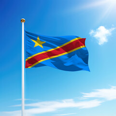 Waving flag of Democratic Republic of the Congo on flagpole with sky background.