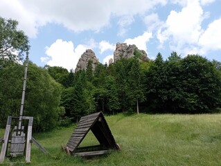 Medieval weapons for storming fortifications. A picturesque glade in the mountains.