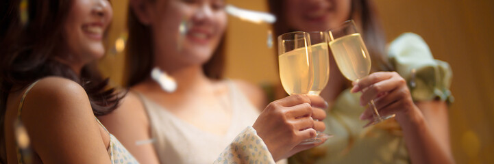 Group of friends celebrating with champagne  Close up on hands.