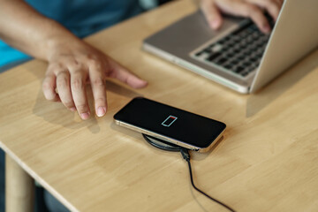 smartphone with wireless fast charger pad, digital device gadget.