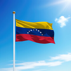 Fototapeta na wymiar Waving flag of Venezuela on flagpole with sky background.