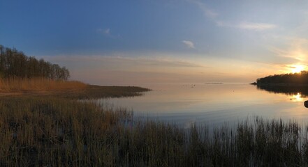evening twilight, beautiful river landscape, smooth water, setting sun