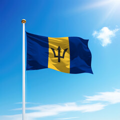Waving flag of Barbados on flagpole with sky background.