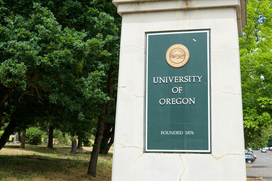 Eugene, OR, USA - June 13, 2023; Sign on pillar at entrance to University of Oregon in Eugene
