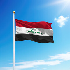 Waving flag of Iraq on flagpole with sky background.
