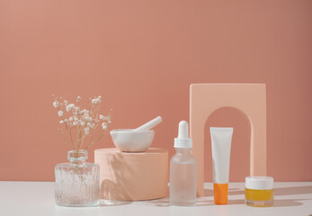 Skincare and beauty product on pastel background with flower.