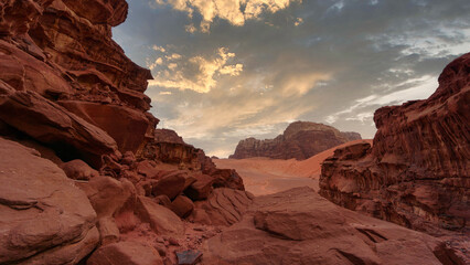 Naklejka na ściany i meble Wadi Rum desert, Jordan, The Valley of the Moon. Orange sand and rocks, storm clouds.