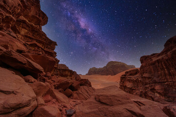 Majestic view of the Wadi Rum desert, Jordan, The Valley of the Moon. Orange sand, Milky Way sky. - obrazy, fototapety, plakaty