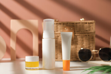mock up skincare and suncare packaging including bottle, tube, and jar. summer beauty and fashion concept.