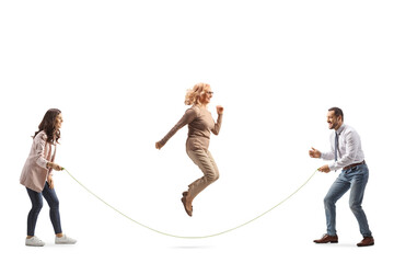 Group of adults playing skipping rope