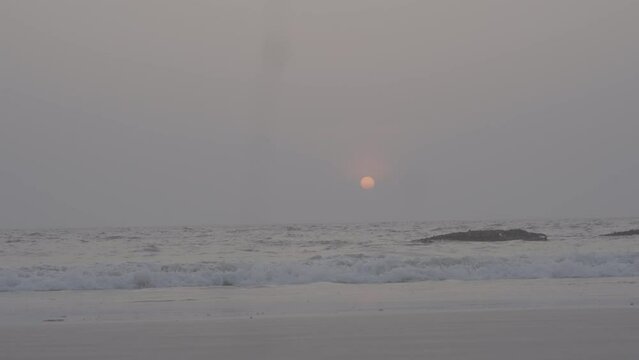 Slow motion 4k 120fps beach ocean wave during evening sunset