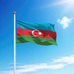 Waving flag of Azerbaijan on flagpole with sky background.