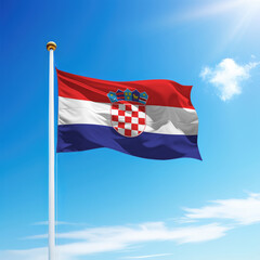 Waving flag of Croatia on flagpole with sky background.
