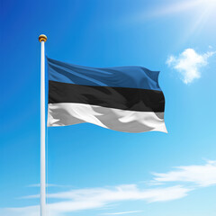 Waving flag of Estonia on flagpole with sky background.